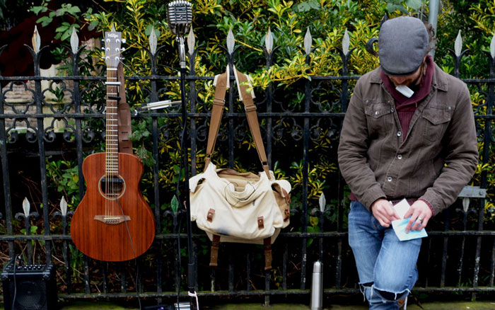 busker helping others through music